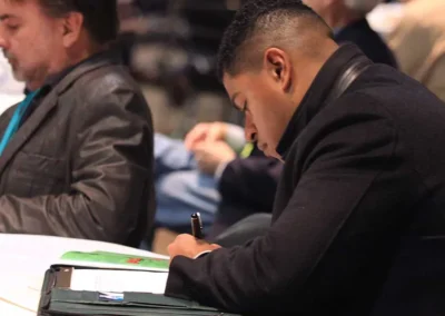 Midwest iHemp Expo attendee taking notes